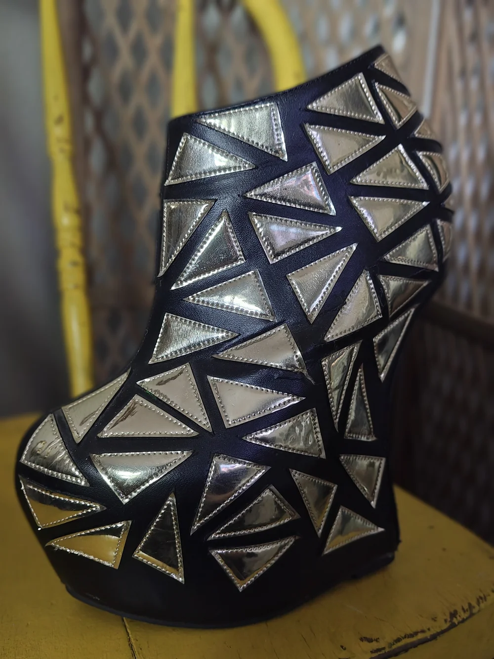 Prestiged Women's Black Ankle Wedge Booties with Gold Geometric Accents
